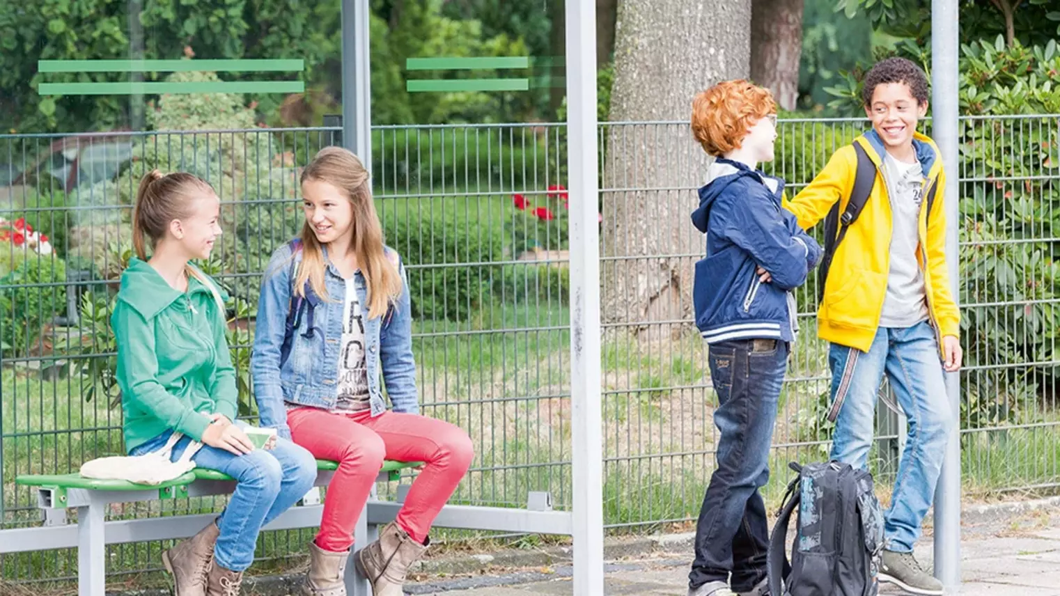 Group of children at a bus stop